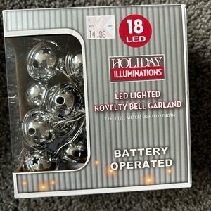 Holiday novelty silver bell garland that illuminates